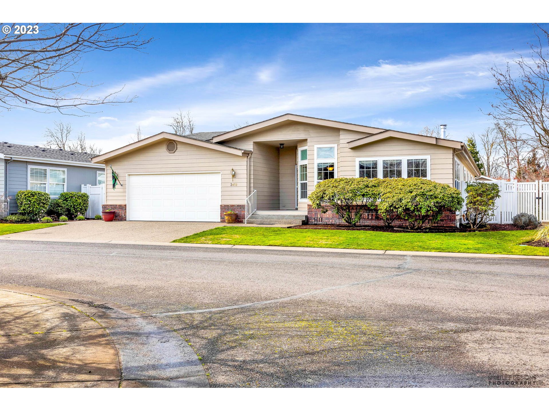 2458 Blue Boy Lane Eugene, OR 97404 - Photo 2 of 28 a view of house with yard and outdoor seating