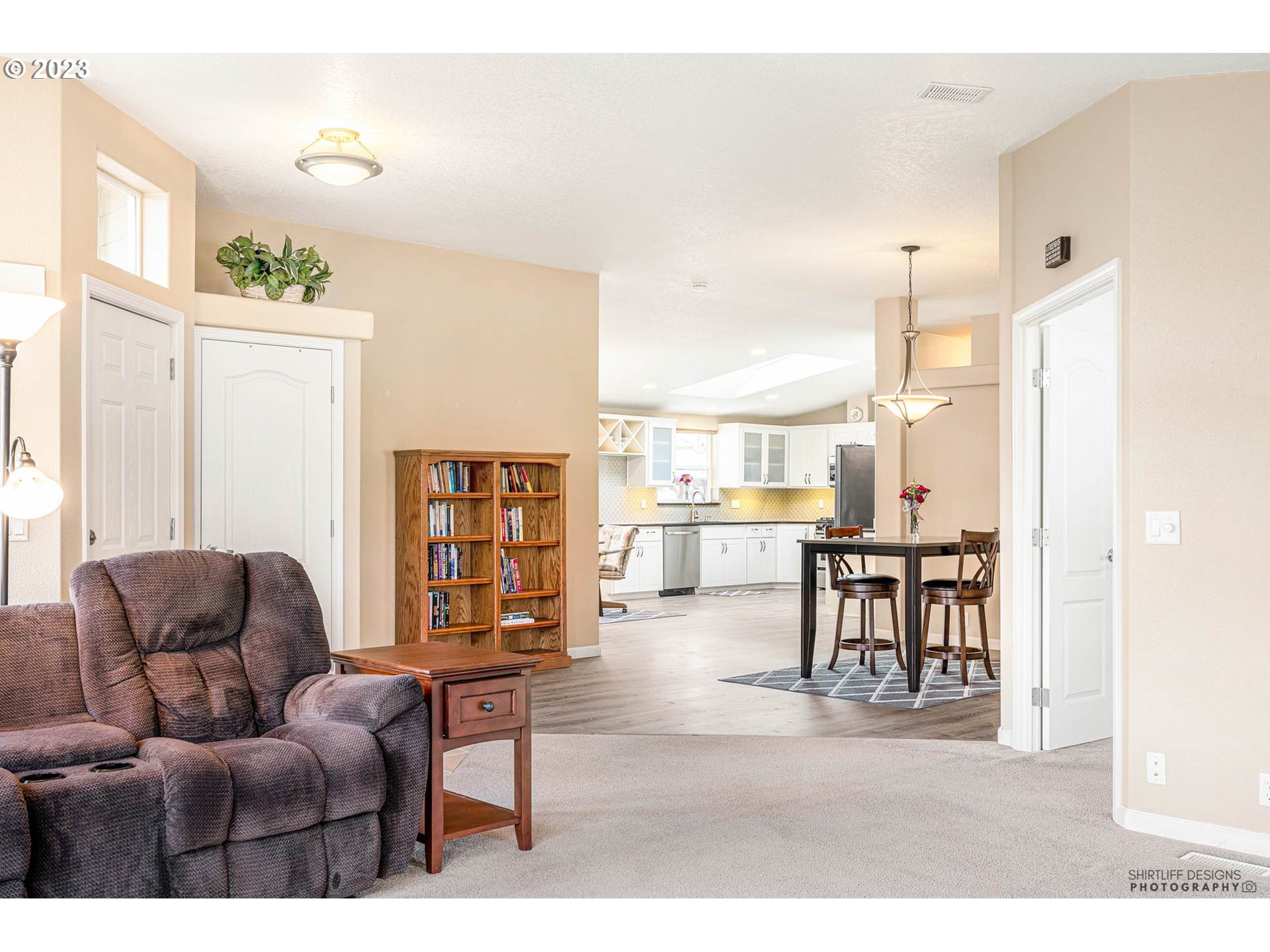 2458 Blue Boy Lane Eugene, OR 97404 - Photo 7 of 28 a living room with furniture wooden floor and a large window