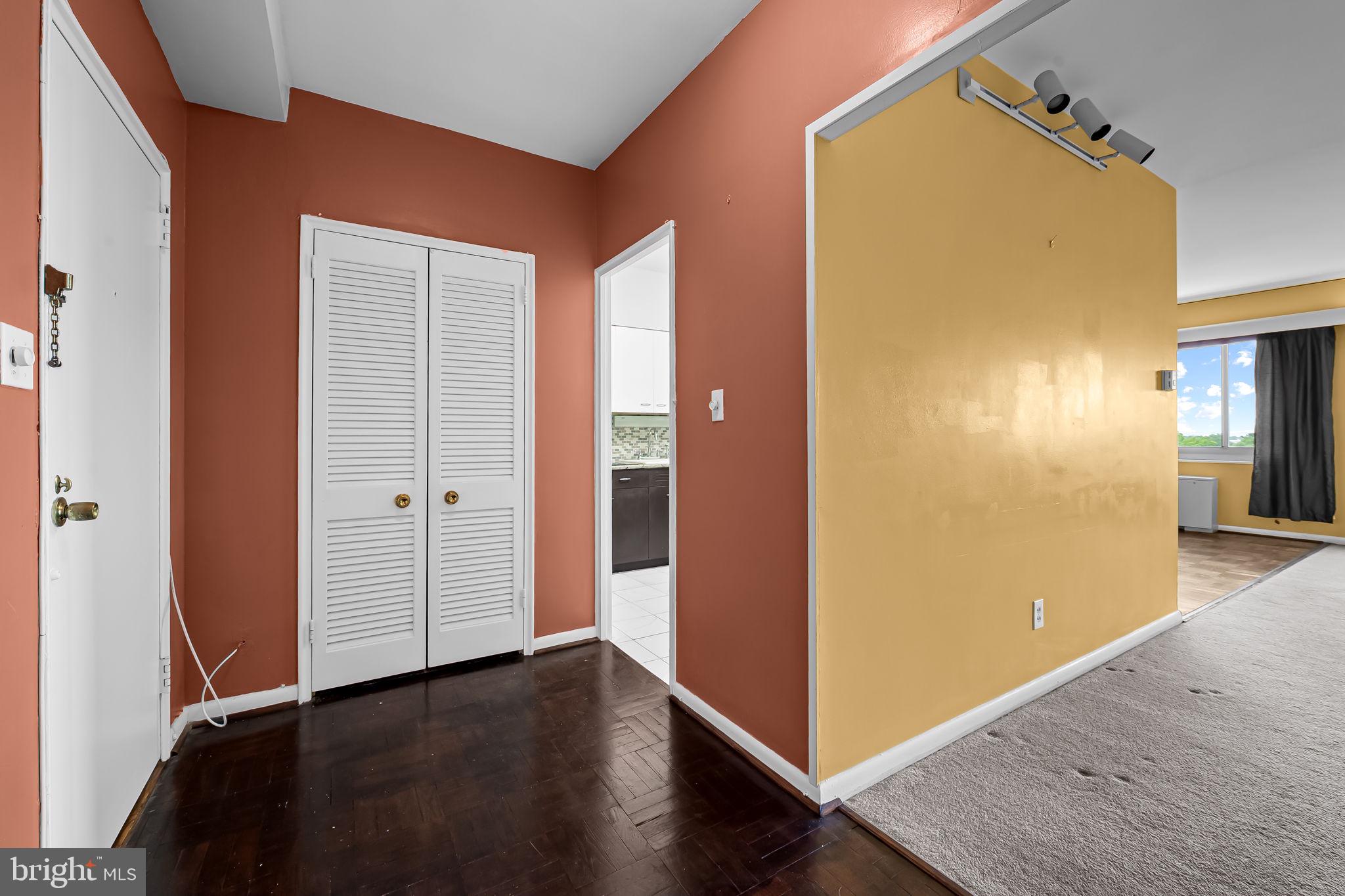 11 Slade Avenue, Unit 804 Baltimore, MD 21208 - Photo 5 of 37 Hall closet and kitchen entry from foyer