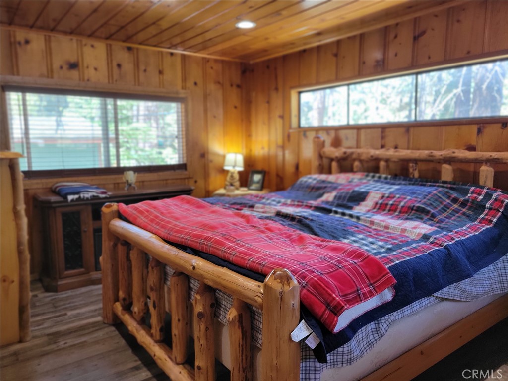 1116 Lark Road Wrightwood, CA 92397 - Photo 30 of 46 a bedroom with a bed and a window