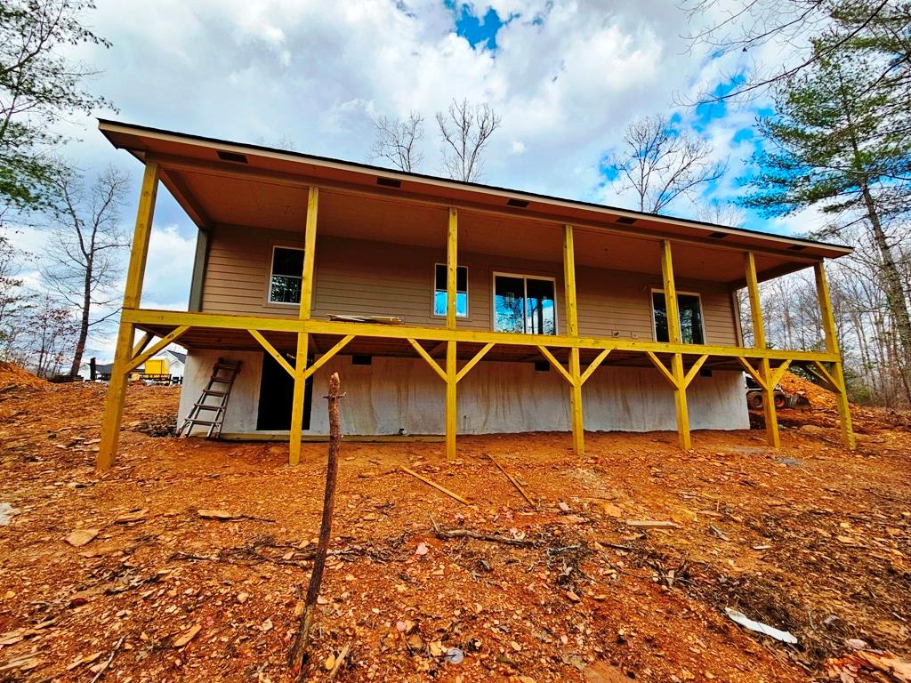 an outdoor view of house with yard gym equipment