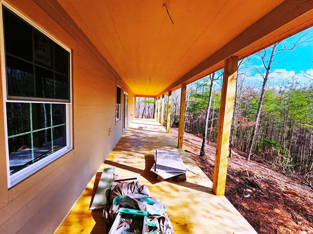 an empty room with a empty space and windows