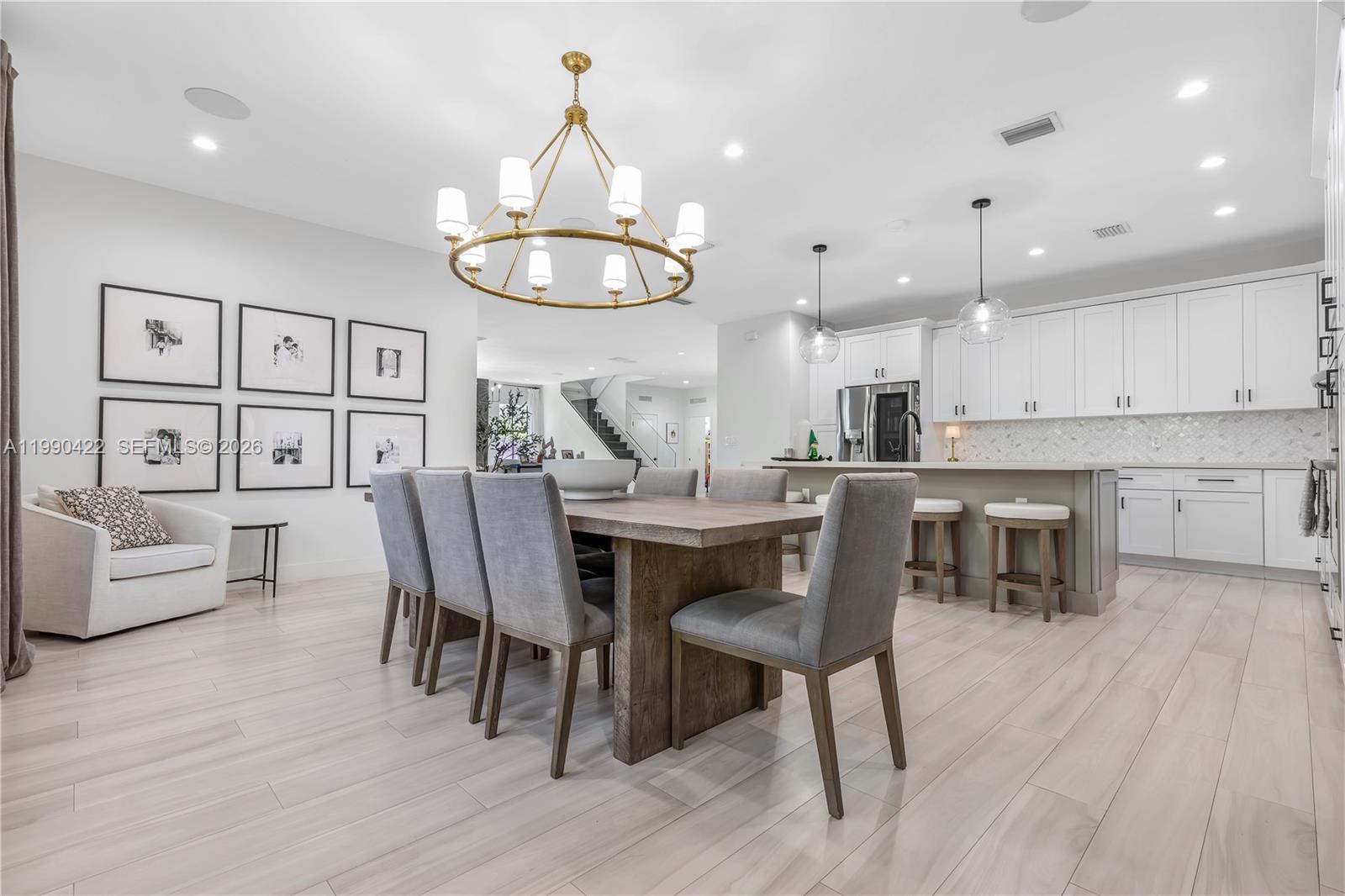 2775 Southwest 101st Court Miami, FL 33165 - Photo 13 of 46 a view of a dining room with furniture and wooden floor