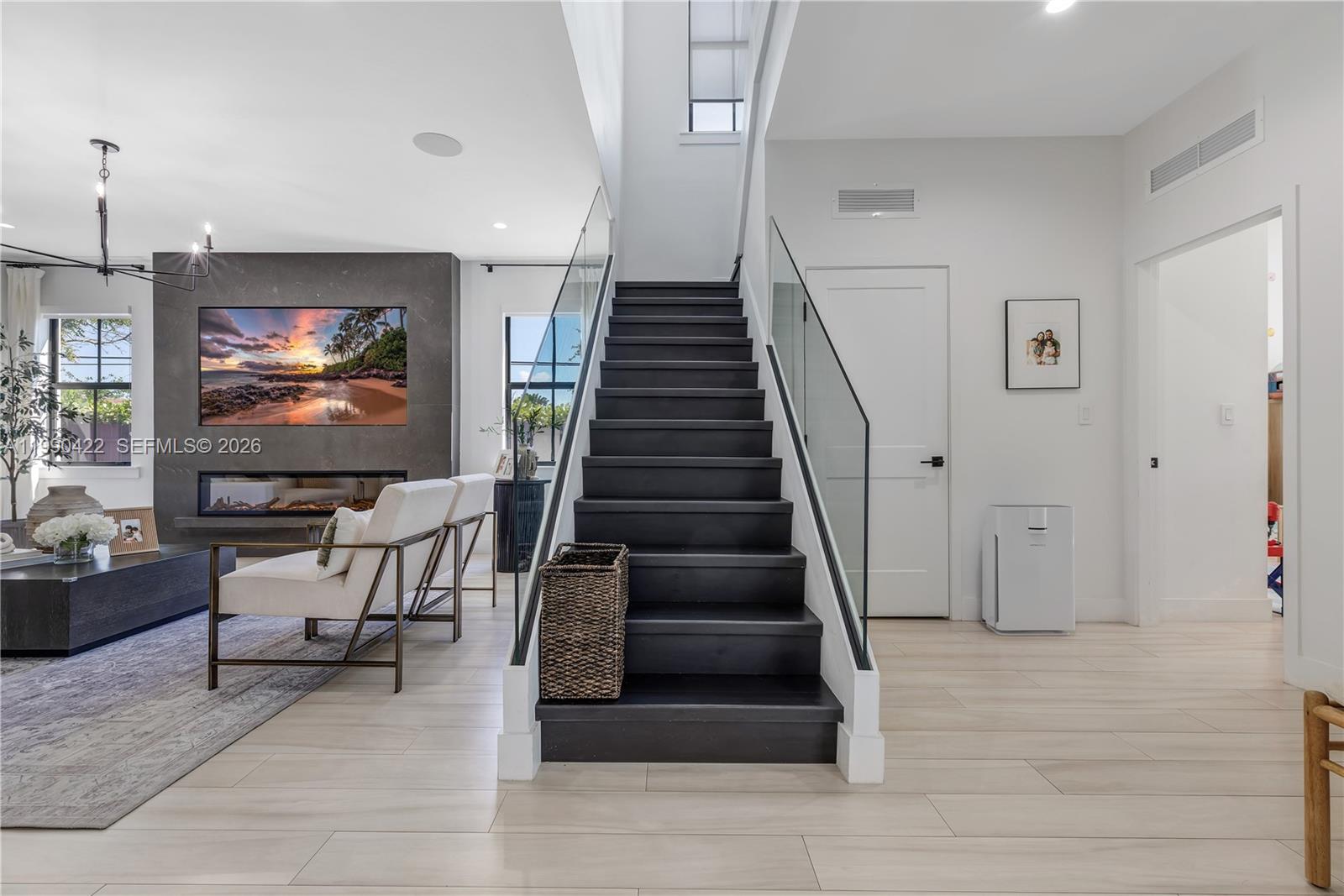 2775 Southwest 101st Court Miami, FL 33165 - Photo 17 of 46 a view of a livingroom with furniture and staircase