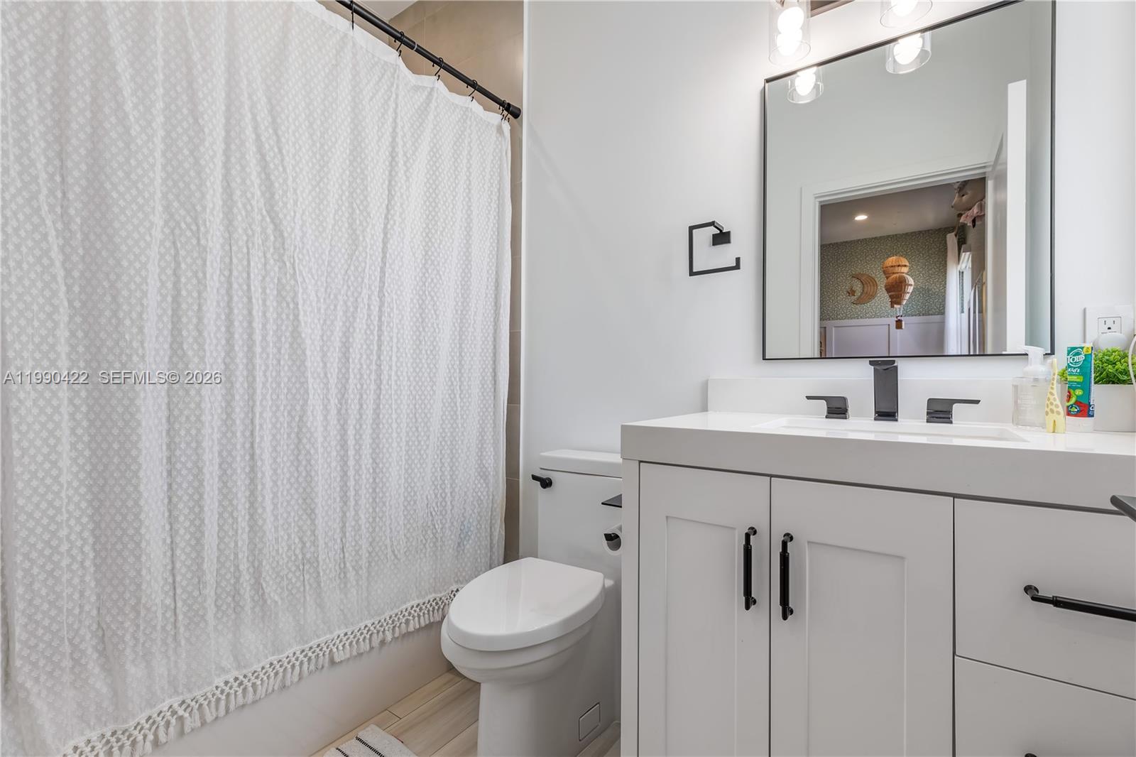 2775 Southwest 101st Court Miami, FL 33165 - Photo 22 of 46 a bathroom with a sink a toilet and shower