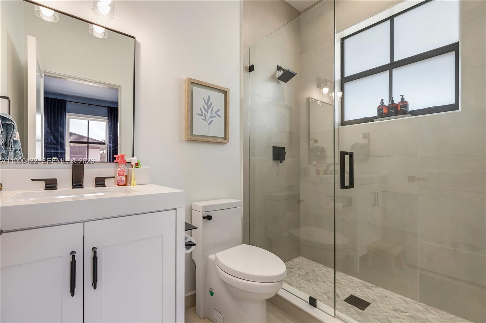 2775 Southwest 101st Court Miami, FL 33165 - Photo 24 of 46 a bathroom with a sink toilet and shower