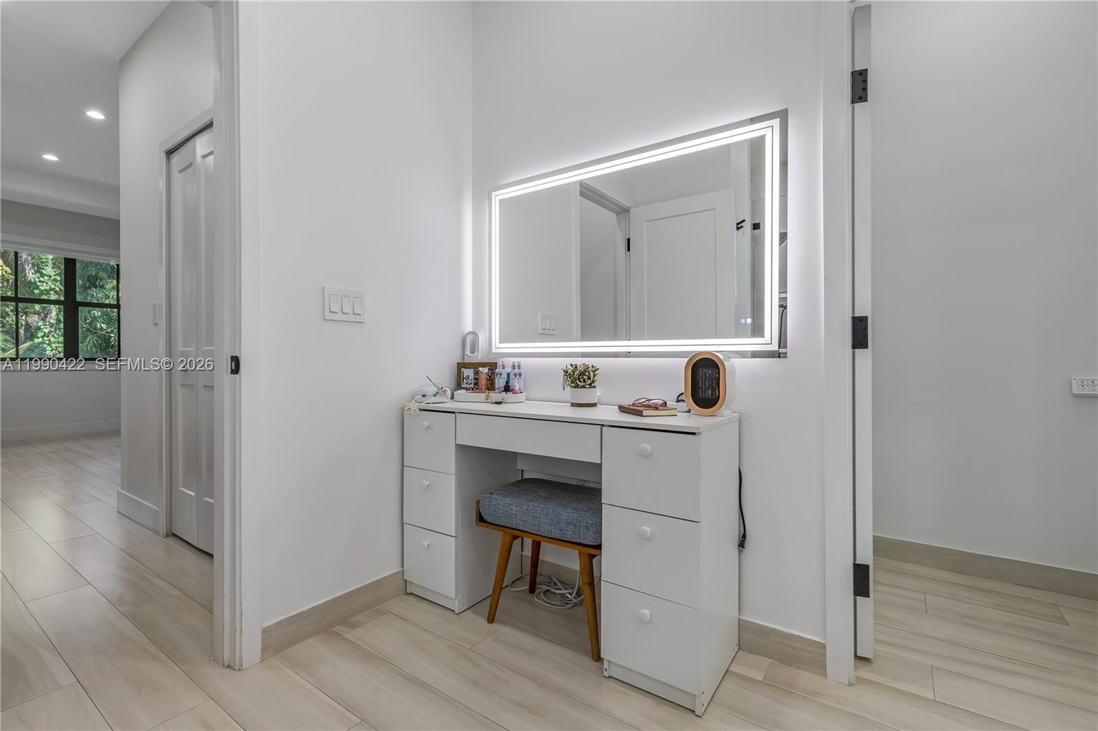 2775 Southwest 101st Court Miami, FL 33165 - Photo 31 of 46 a bathroom with a sink a chair and a mirror
