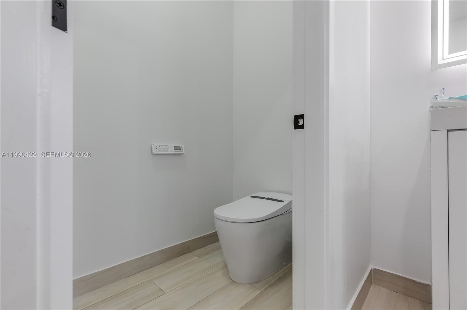 2775 Southwest 101st Court Miami, FL 33165 - Photo 32 of 46 a white toilet sitting next to a white wall