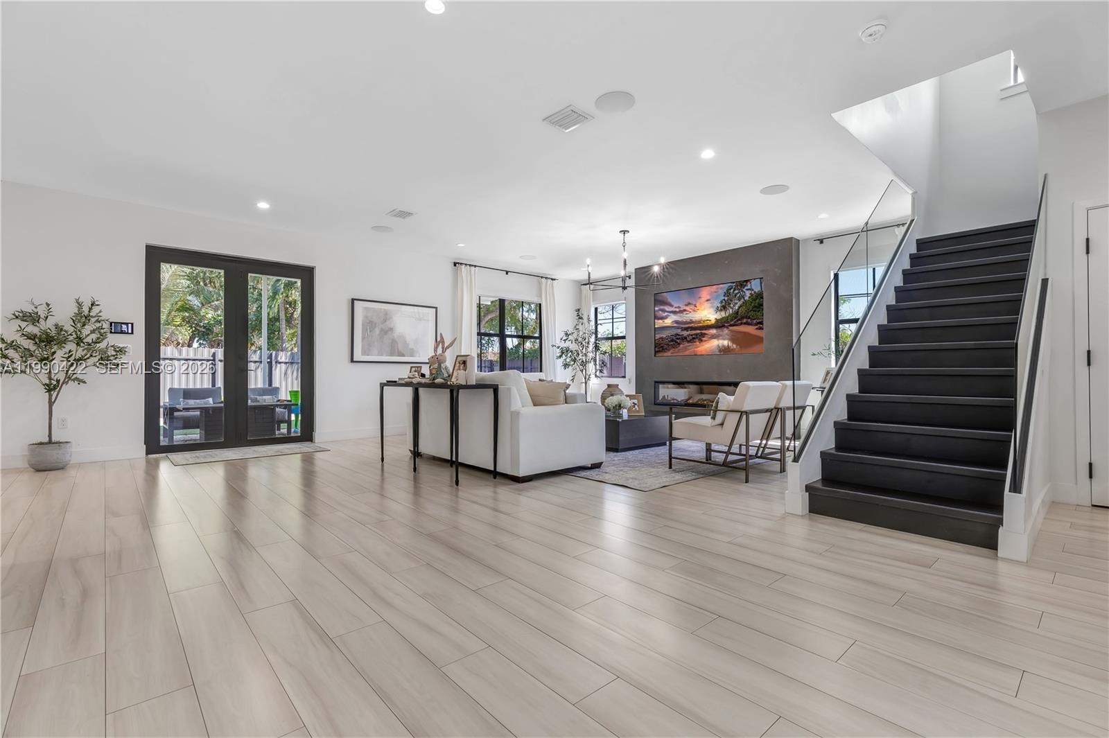 2775 Southwest 101st Court Miami, FL 33165 - Photo 4 of 46 a living room with furniture and a wooden floor