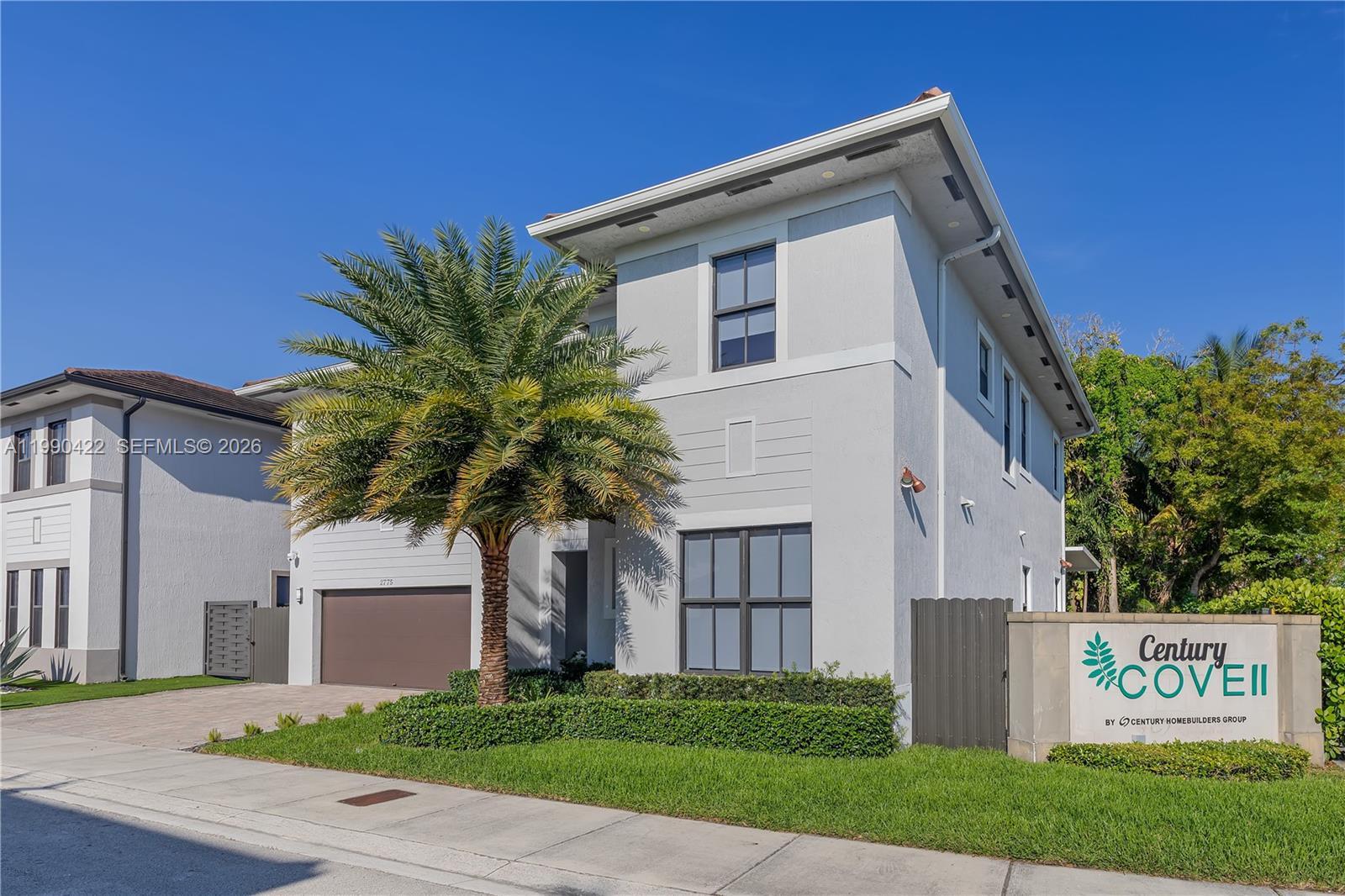 2775 Southwest 101st Court Miami, FL 33165 - Photo 42 of 46 a front view of a house with a garden and trees