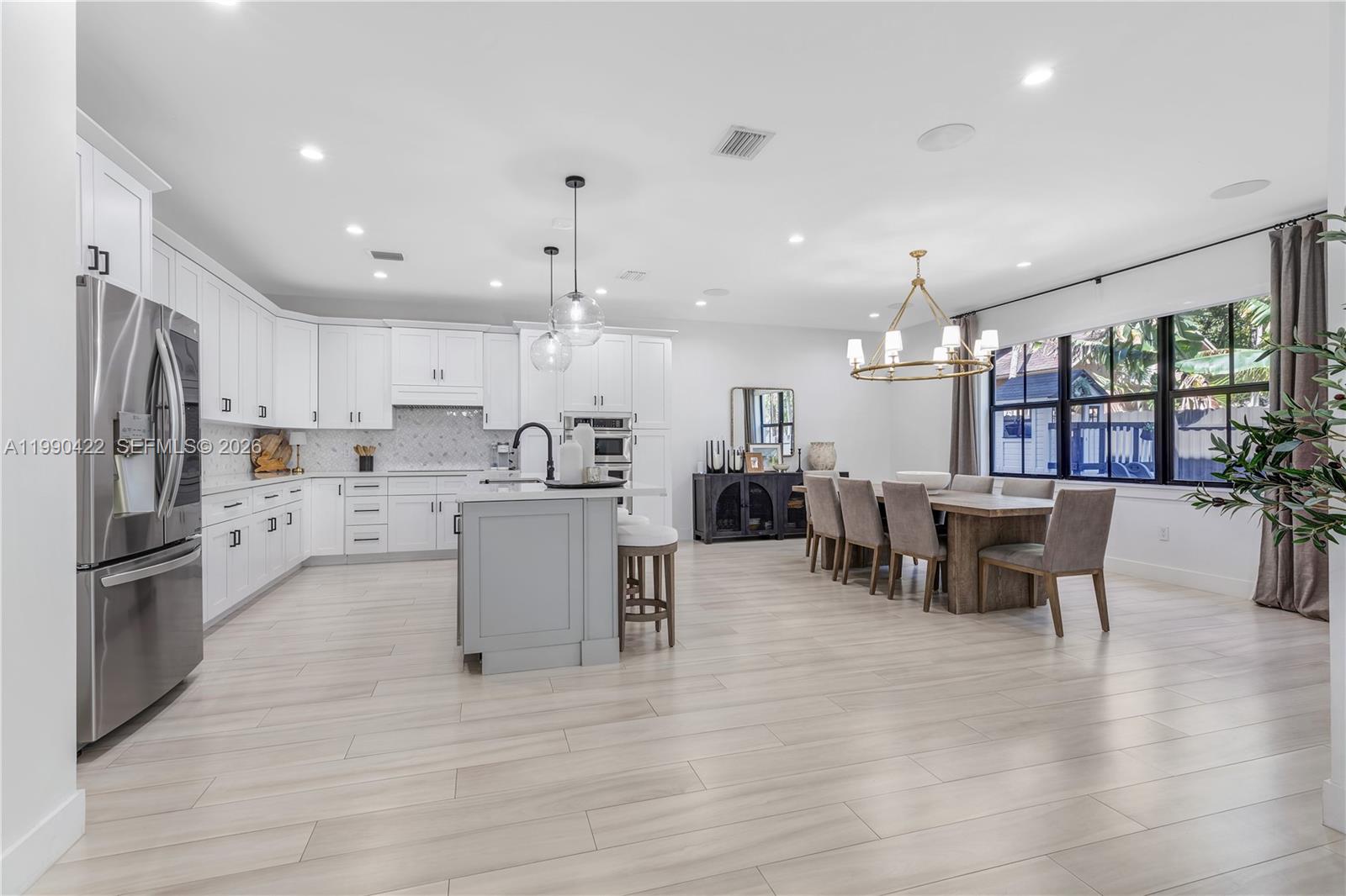 2775 Southwest 101st Court Miami, FL 33165 - Photo 7 of 46 a kitchen with a refrigerator and a table