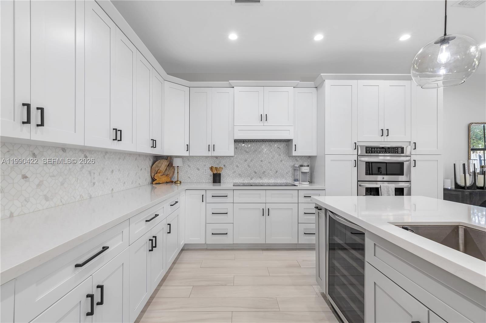 2775 Southwest 101st Court Miami, FL 33165 - Photo 8 of 46 a kitchen with granite countertop white cabinets and white appliances
