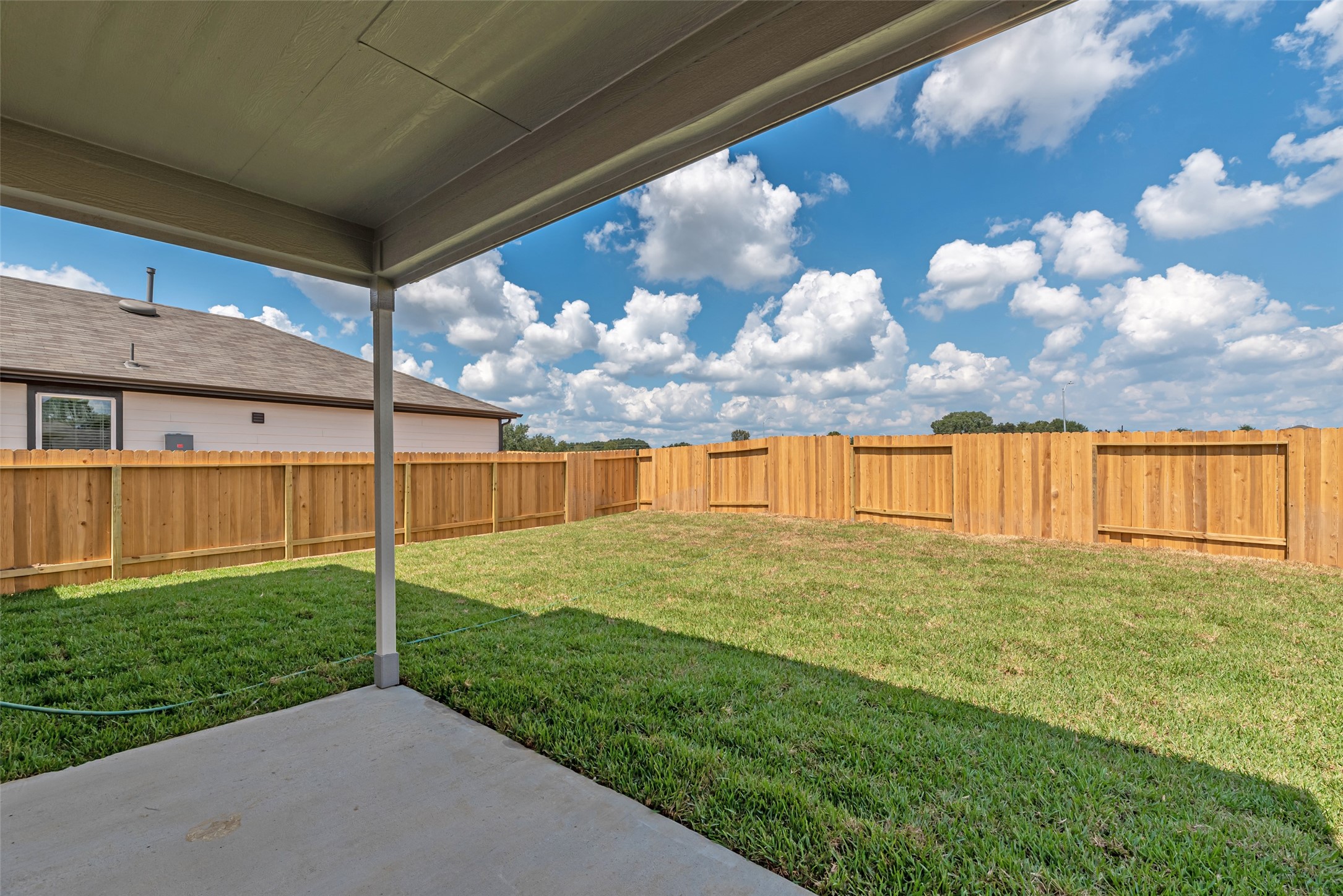 23422 Wagon Cart Road Hockley, TX 77447 - Photo 25 of 28 a view of a backyard with a garden