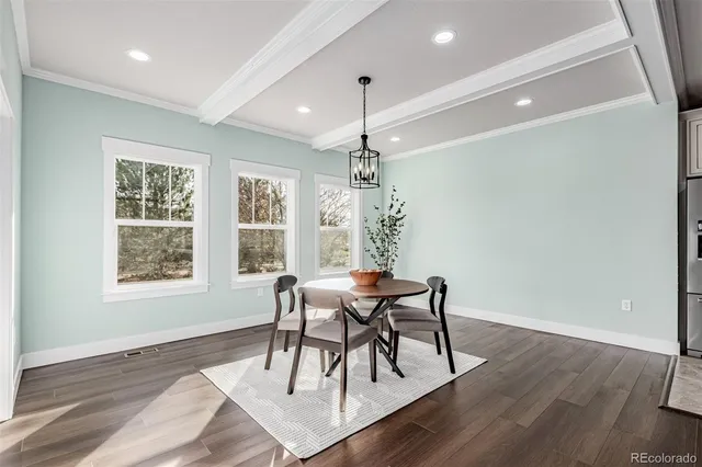 a view of a dining room with furniture window and wooden floor