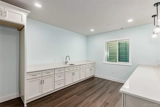 a view of a kitchen with wooden floor