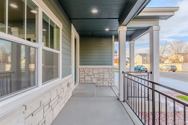 a view of a porch with wooden floor
