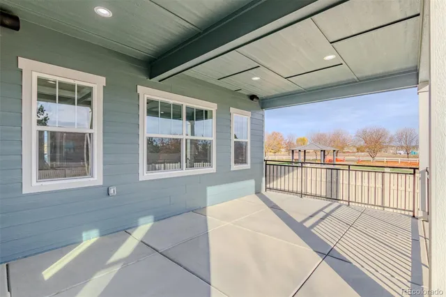a view of a balcony with wooden floor