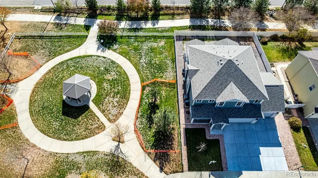 an aerial view of a house with swimming pool and outdoor space