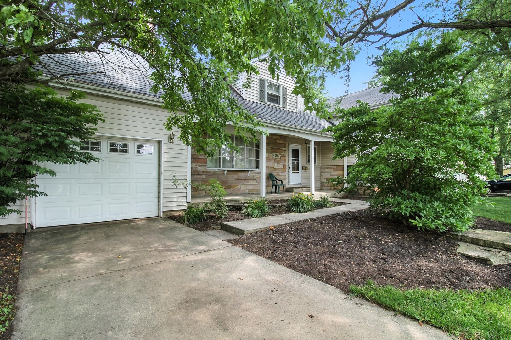 406 Madison Street Joliet, IL 60435 - Photo 1 of 40 a view of a house with a yard and large tree