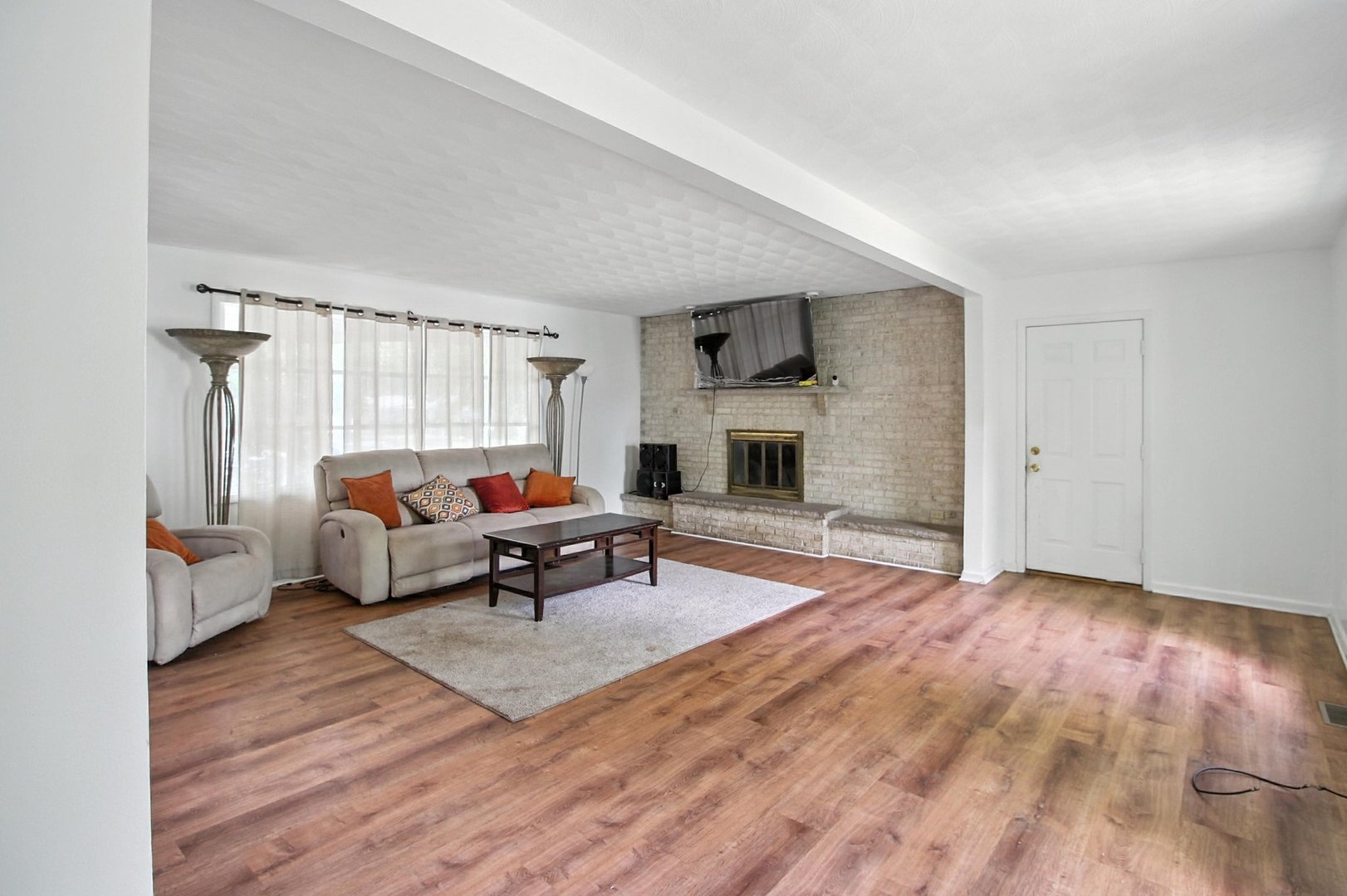 406 Madison Street Joliet, IL 60435 - Photo 11 of 40 a living room with furniture and a fireplace