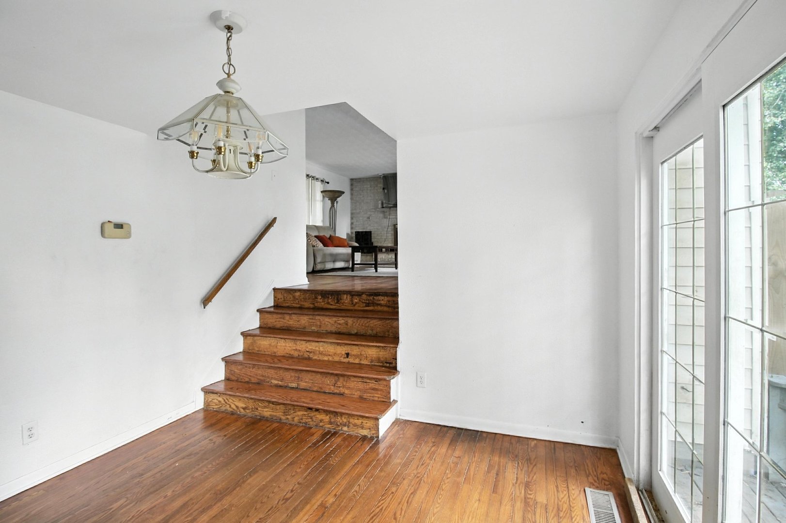 406 Madison Street Joliet, IL 60435 - Photo 14 of 40 a view of entryway and hall with wooden floor
