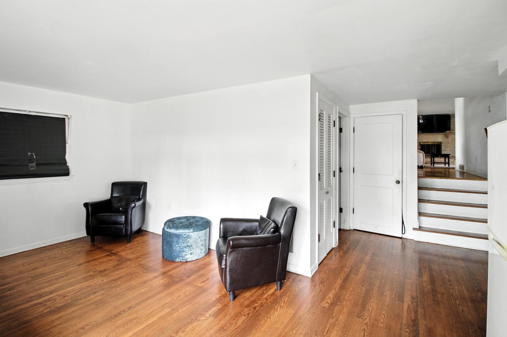 406 Madison Street Joliet, IL 60435 - Photo 18 of 40 a living room with furniture and a wooden floor