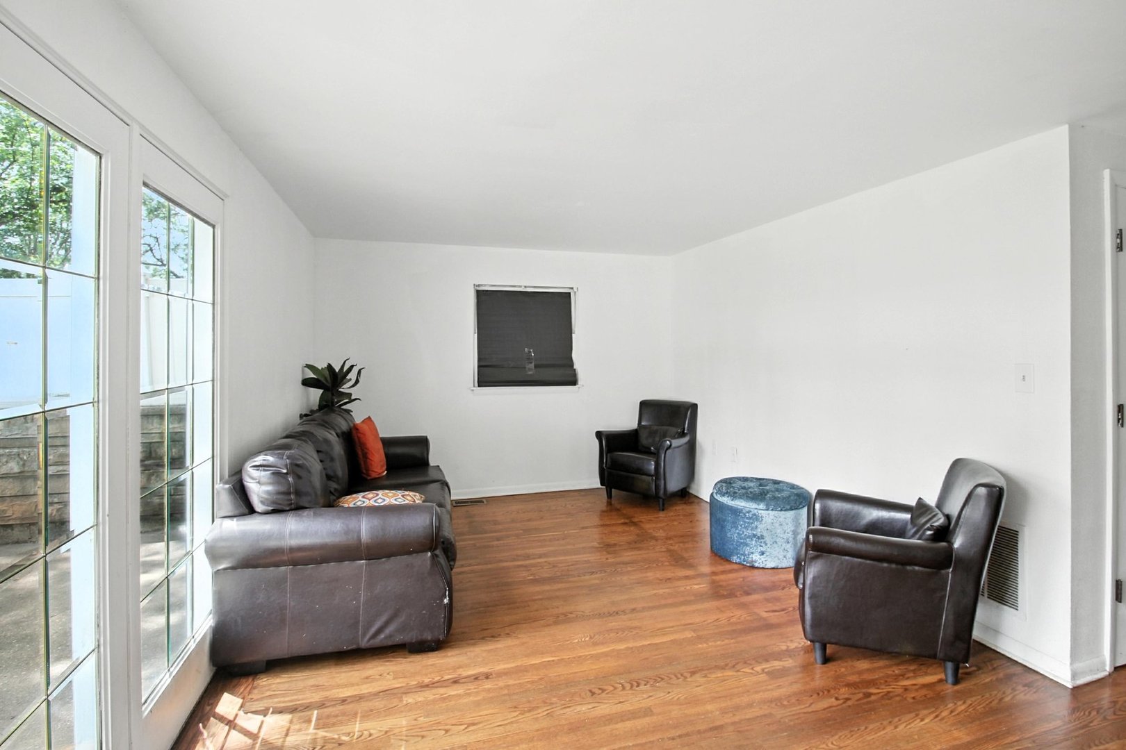 406 Madison Street Joliet, IL 60435 - Photo 19 of 40 a living room with furniture and a flat screen tv