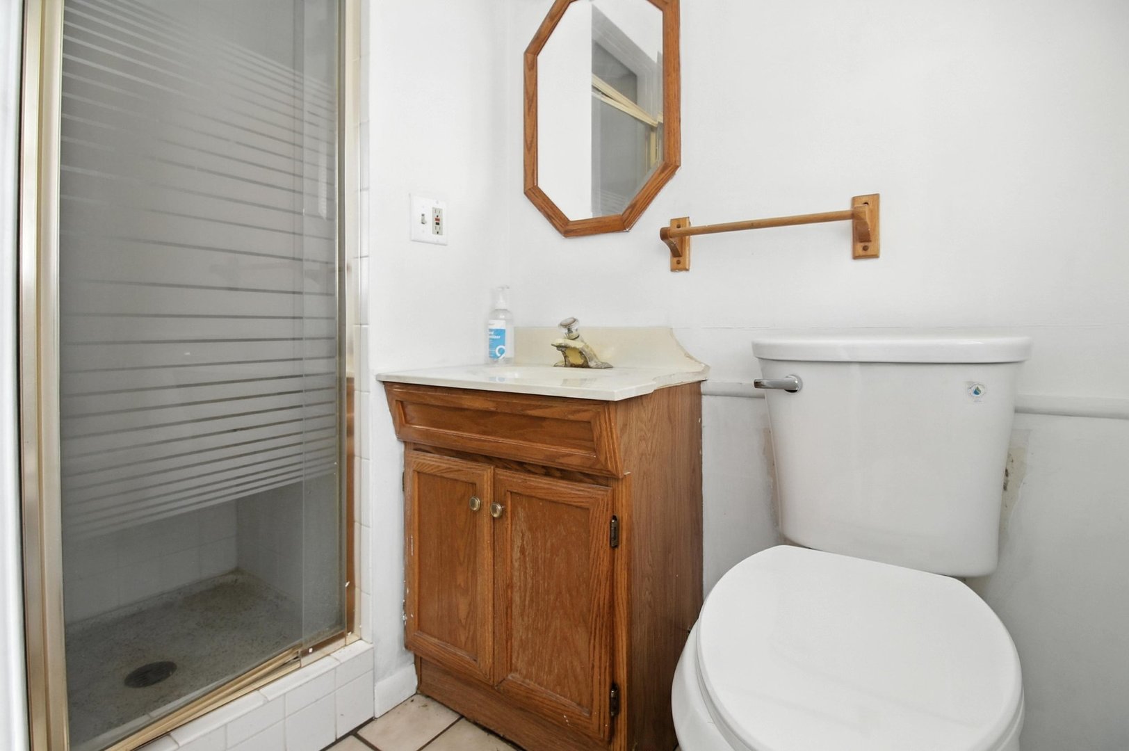 406 Madison Street Joliet, IL 60435 - Photo 21 of 40 a bathroom with a toilet sink and mirror