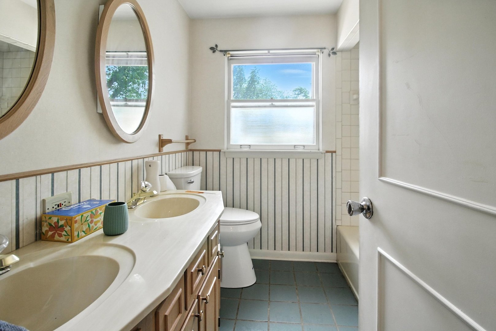 406 Madison Street Joliet, IL 60435 - Photo 24 of 40 a bathroom with a sink and a mirror