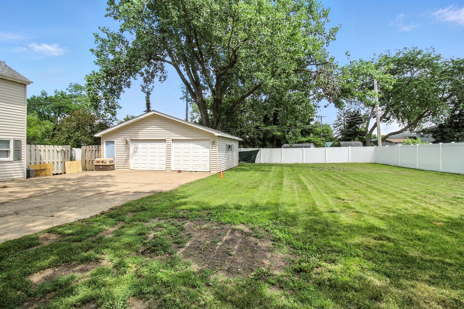 406 Madison Street Joliet, IL 60435 - Photo 8 of 40 a front view of a house with a yard