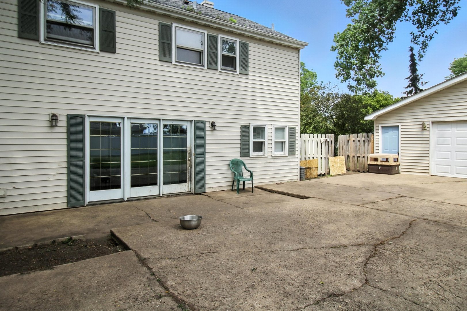 406 Madison Street Joliet, IL 60435 - Photo 9 of 40 a view of a house with backyard and sitting area
