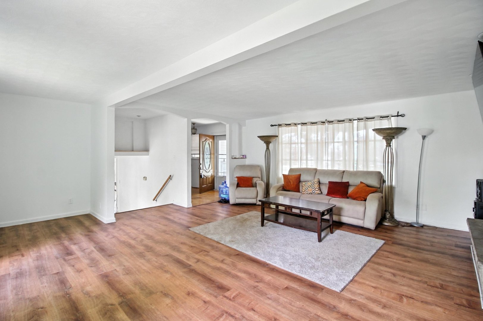 406 Madison Street Joliet, IL 60435 - Photo 10 of 40 a living room with furniture and a wooden floor