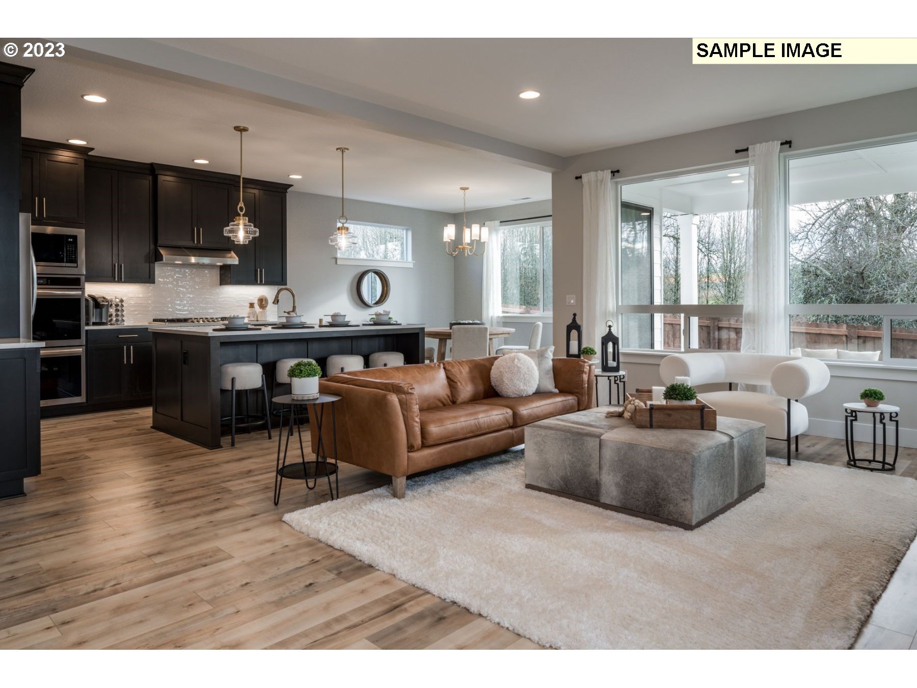 1107 South 46th Place Ridgefield, WA 98642 - Photo 5 of 21 a living room with furniture kitchen view and a large window
