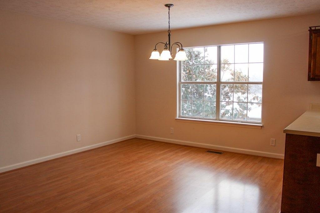 803 Red Hollow Drive Springfield, TN 37172 - Photo 5 of 9 a view of an empty room with wooden floor and a window