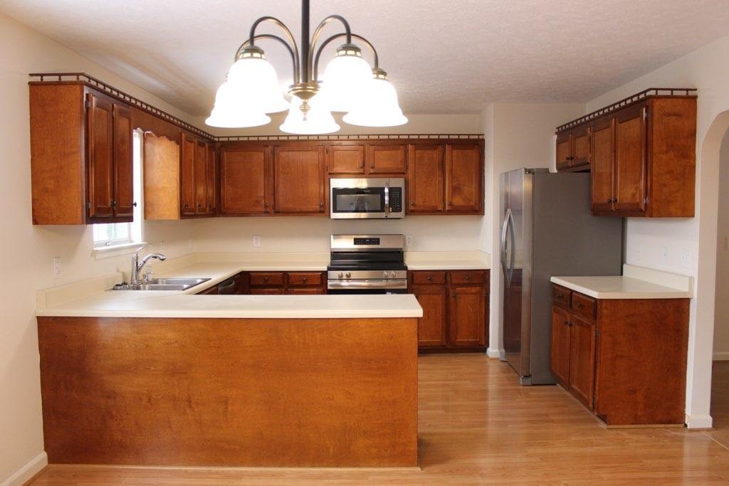 803 Red Hollow Drive Springfield, TN 37172 - Photo 6 of 9 a kitchen with stainless steel appliances granite countertop a sink a stove and a refrigerator