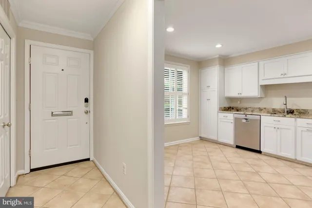 a kitchen with a stove a sink dishwasher and a refrigerator