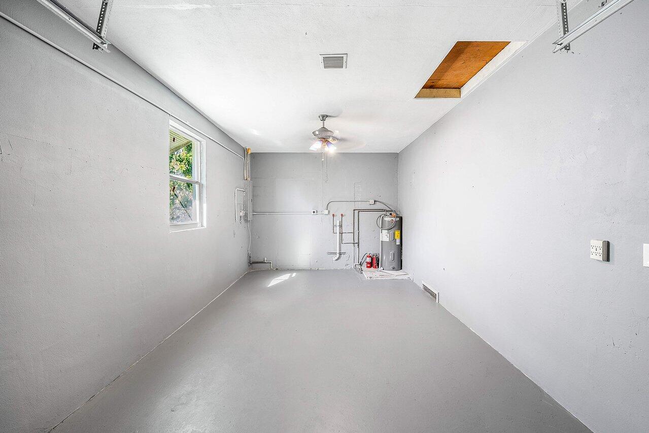 3527 Kirk Road Lake Worth, FL 33461 - Photo 23 of 25 an empty room with windows and ceiling fan