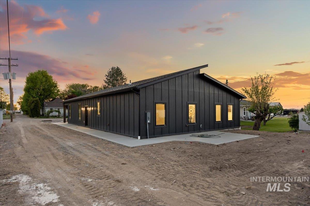107 3rd Street West Declo, ID 83323 - Photo 28 of 29 Modern black board and batten exterior with a low-slope roofline