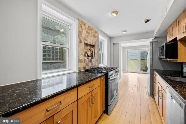a view of livingroom with furniture and a potted plant