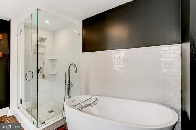 a bedroom with a bed and a television