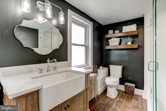 a bedroom with a bed and a television