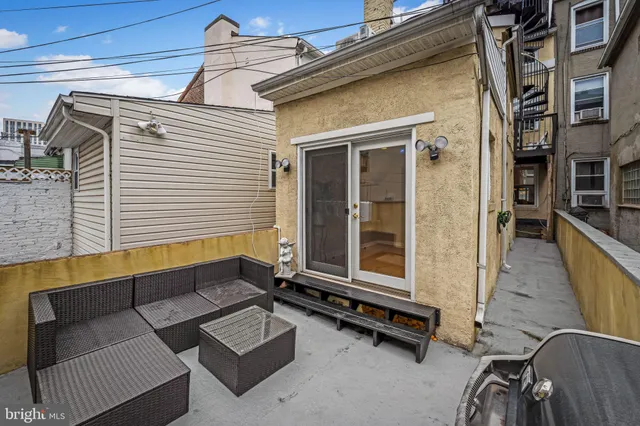 a view of a balcony with wooden floor