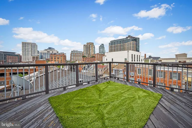a view of a balcony with city