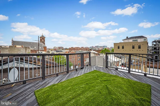 a car parked in front of a white building
