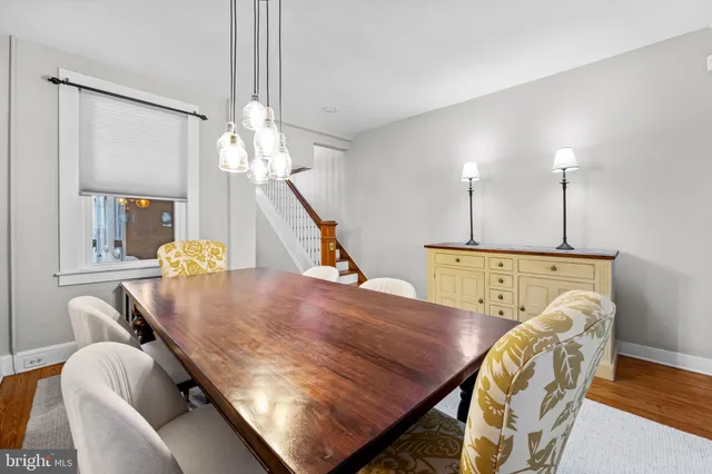 a view of a dining room with furniture and chandelier