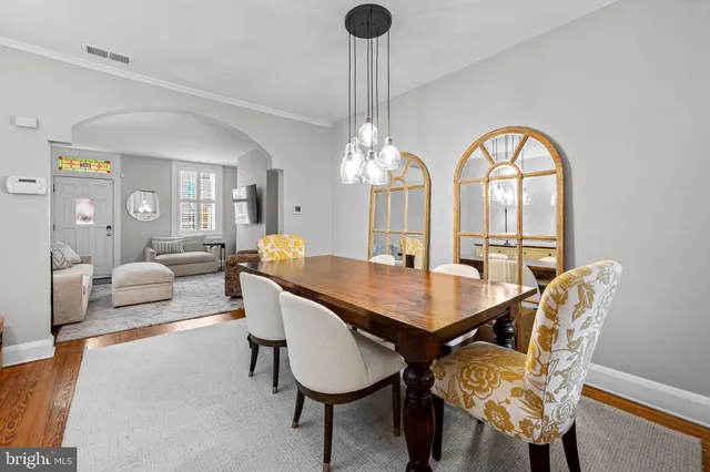 a kitchen with stainless steel appliances granite countertop a sink a stove and cabinets