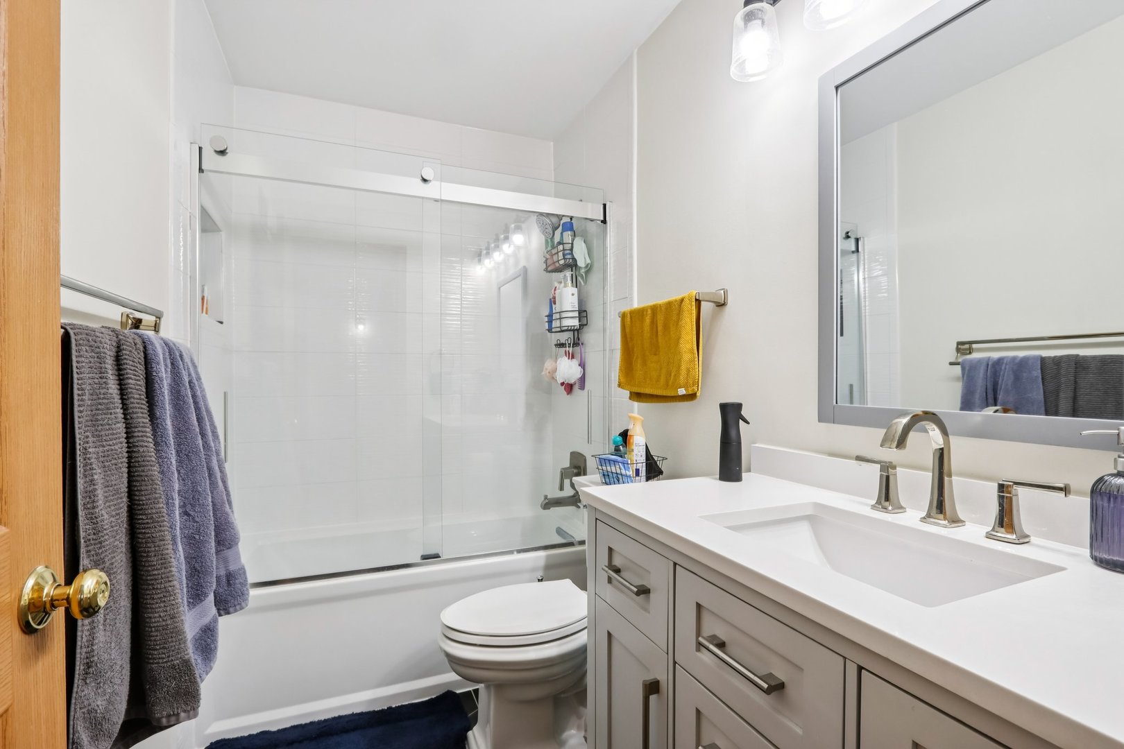 1010 Symphony Drive Aurora, IL 60504 - Photo 19 of 28 a bathroom with a sink toilet and shower