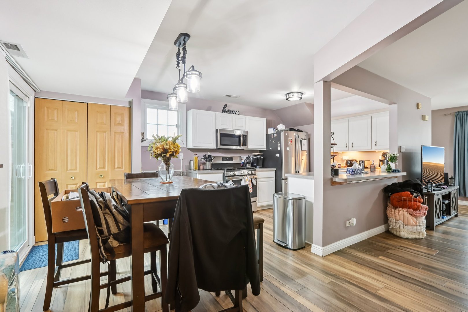 1010 Symphony Drive Aurora, IL 60504 - Photo 8 of 28 a kitchen with refrigerator a sink dishwasher and wooden cabinets
