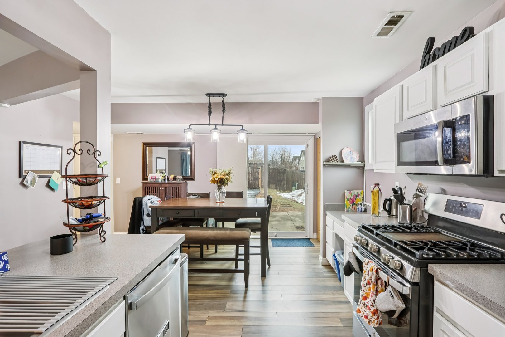1010 Symphony Drive Aurora, IL 60504 - Photo 9 of 28 a kitchen with a stove a sink and a refrigerator
