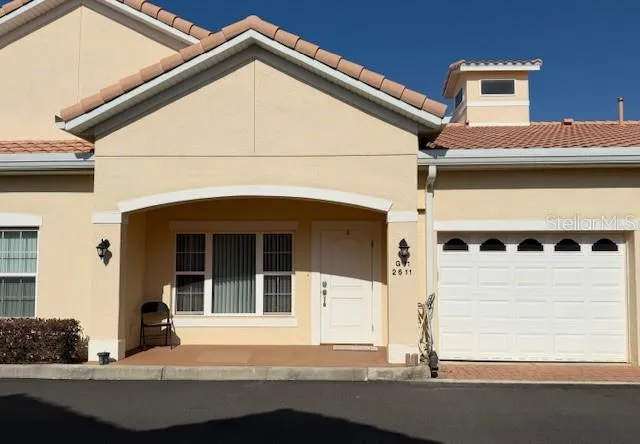 $255,000 | 2611 Shantiniketan Boulevard, Unit G11, Tavares, FL 32778